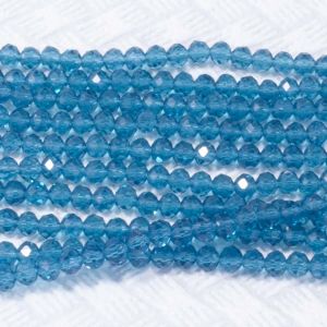 Намистини Ронделли 6,0 мм прозорі, 20 темно бірюзового кольору