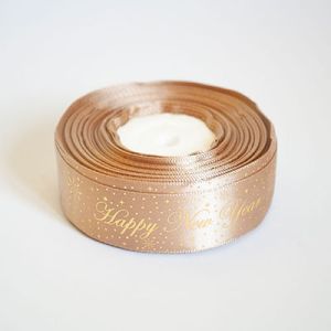 Лента атласная новогодняя "Happy New Year звездочки" 2,5 см. 22,5м. светло коричневая