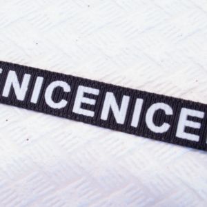 Стрічка репсова чорна з написами 0,9 см NICE